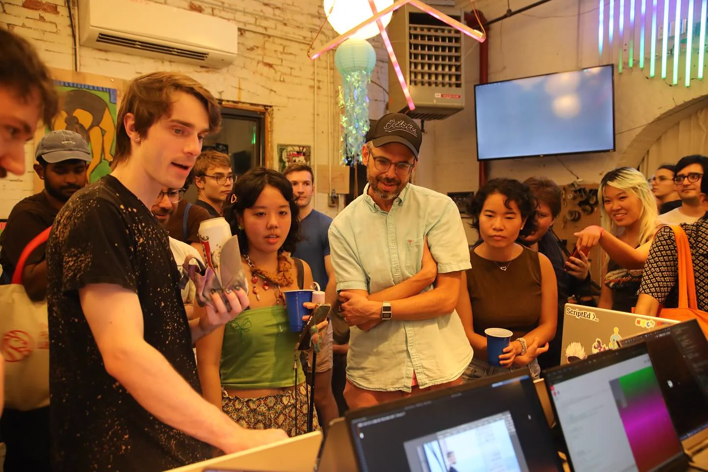 Creative Coding NYC members gathered around a live project demonstration